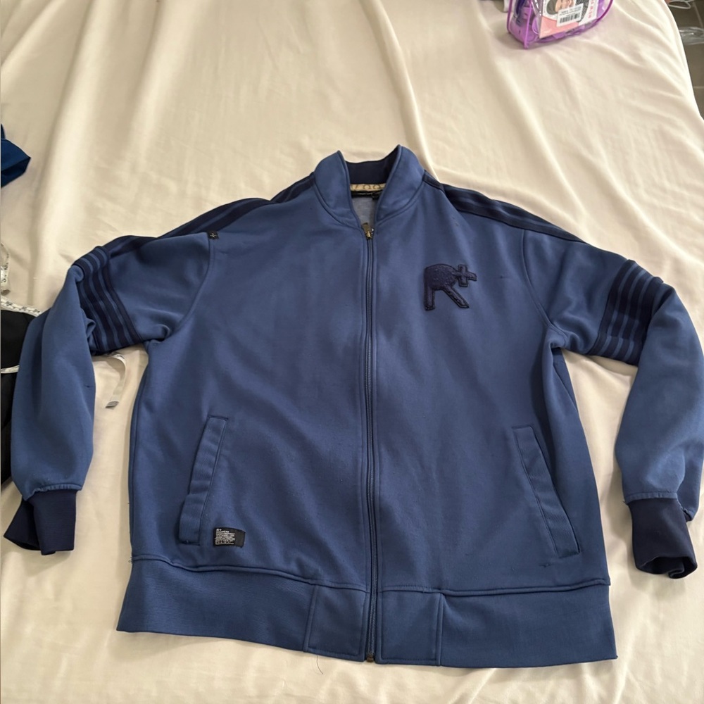 Stained . Rocawear men’s large zip up jacket . Small stain near top of collar